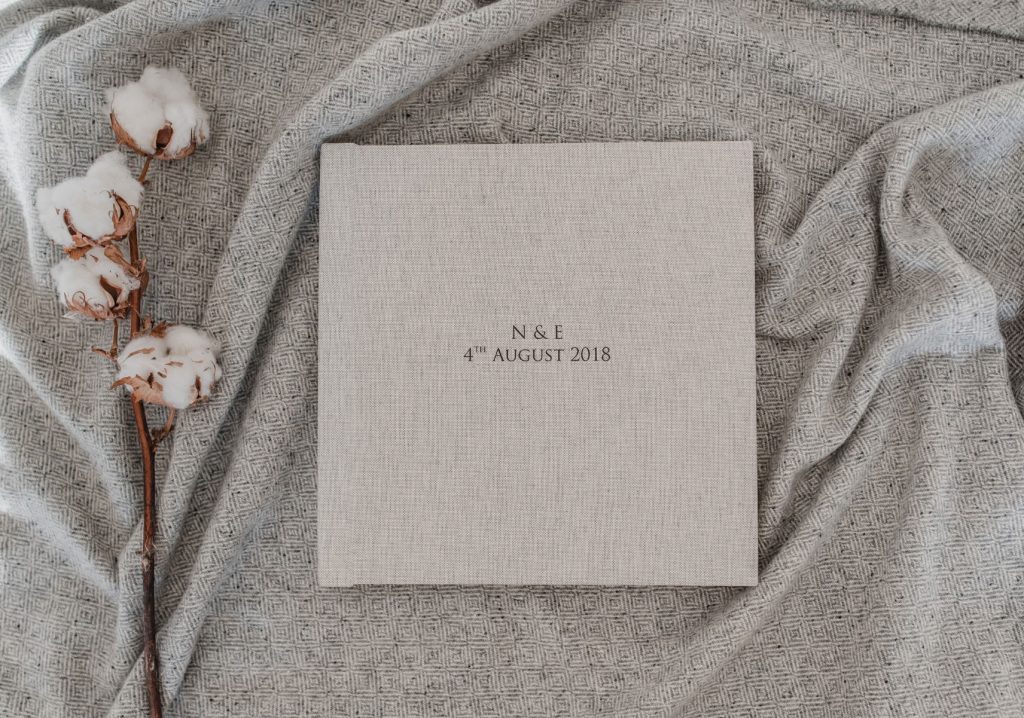 Cotton covered album with black writing